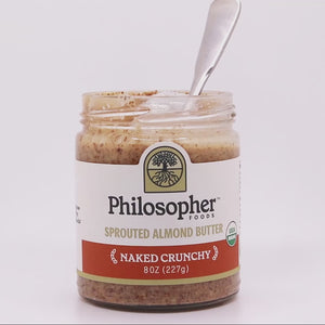 Video of spoon dipped into a jar of Naked Crunchy flavor. Texture is thick and crunchy while still not sticking to the spoon, dripping into the jar.