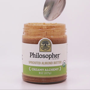 Video of spoon dipped into jar of Creamy Alchemy. So smooth and pourable it drips right off the spoon.